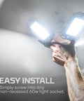 High Bright 9000 Lumen Garage Light With Adjustable Panels being installed into a standard ceiling socket, easy and tool-free.