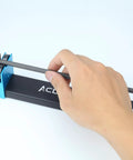 Hand using Pro Grade Arrow Spinner Tester For Shaft Straightness And Vane Tuning All Aluminum Arrow Squaring Tool.