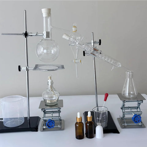 Front view of two stainless steel lab jack stands with clamps and glassware on a lab bench