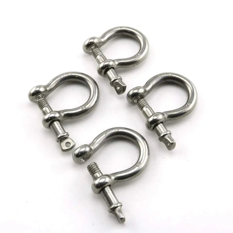 Badass Heavy Duty Bow Shape Screw Pin Anchor Shackle One Quarter Inch 304 Stainless Steel Four Pack 716 Pound Working Load Limit For Chain Rigging Wire Rope And Tough Outdoor Builds - close-up of four shackles.