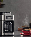 No Sweat Fully Automatic Bean To Cup Coffee Maker Featuring A Built In Grinder Smart Permanent Filter with steaming coffee mug.