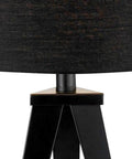 Close-up of Warm Rustic Wood Tripod Table Lamp With Off White Textured Shade Hidden Cord And Three Way Rotary Switch For Cozy Living Room