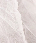 Close-up of White nonwoven material for 10 Pcs Disposable Nonwoven Bouffant Hair Caps With Straight Comfort Elastic Fit For Full Head And Face Shield.