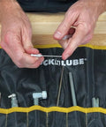 LockNLube grease injector needle kit in a black pouch with yellow trim; metal tips visible.