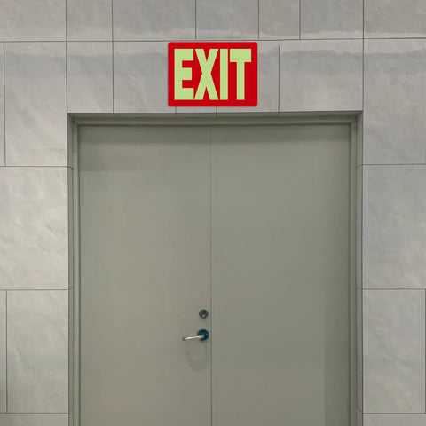 Glow In The Dark Emergency Exit Signs 2 Pack Photoluminescent Vinyl For 50 Feet Visibility No Wiring Needed Flexible Arrows System For Easy Setup Lets You Show Clear Safe Path In Any Hallway Or Stairwell. above gray door
