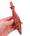 Hand holding wood cuckoo clock pendulum, part of Cuckoo Clock Hammer Replacement Set Of 2, 5.9 Inch Vintage Pendulum Accessory.
