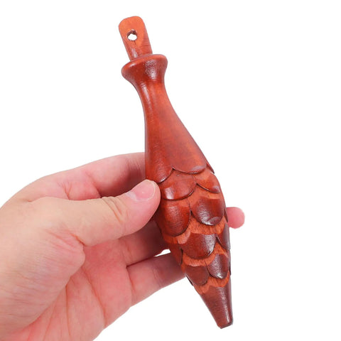 Hand holding wood cuckoo clock pendulum, part of Cuckoo Clock Hammer Replacement Set Of 2, 5.9 Inch Vintage Pendulum Accessory.