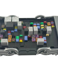 Real Deal Engine Fuse Box Assembly 19210438, top view, showing colorful fuses and relays, for 2007-2009 Chevy Silverado, GMC Sierra.