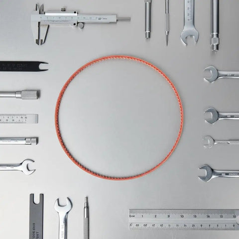 12 Inch Drive Belt Closed Loop PE Round Belt surrounded by tools, high performance, heavy duty replacement for lathes and more