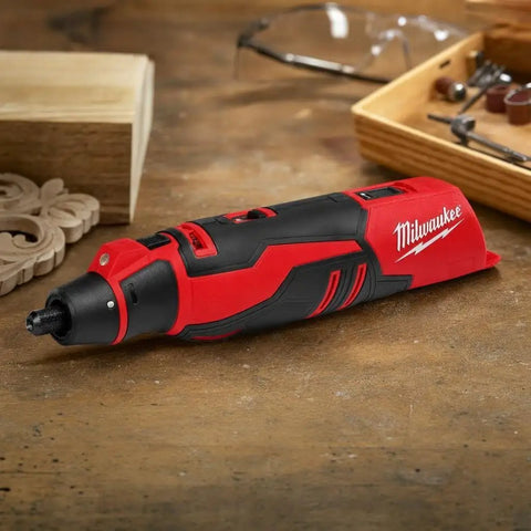 Badass Brushless Cordless Rotary Tool Kit With Whopping Variable Speed Range 5000 To 27500 Rpm And Redlink Intelligence on wooden surface.