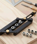 Precision Aluminum Dowel Jig Drill Guide with threaded bushings on wood surface for accurate woodworking joinery.