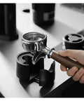 Heavy Duty Adjustable 51 53 58 Millimeter Portafilter Holder Tamping Platform crafted from tough aluminum with portafilter.