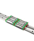 Top Shelf Linear Motion Guide Slider And Rail Set Packing Four Reliable Hgh25Ca Slides And Two Heavy Duty Hgr25 Rails close-up of sliders on steel rails.