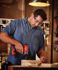 Person using 20V Cordless Impact Driver Kit With One Quarter Inch Quick Release Chuck, 1,460 In Lbs Torque for woodworking