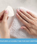 Lint Free Premium Nail Wipes 1.75 Inch Cotton Rounds For Removing Nail Polish With Easy Grip Tabs in hand next to nails