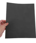 Get The Ultimate Multipurpose Sandpaper Set With 10 Sheets Of Assorted Grits Perfect For Smooth Wood Furniture Refinishing And Polishing Auto Surfaces Lightweight Wet Dry Carborundum Paper That Lets You Crush Any DIY Project With Ease - Hand holding a grey sandpaper sheet.