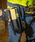 Leather 4 Pocket Tool Pouch With Plier, Ruler And Screwdriver Holders, Worksite Tough Belt Tool Organizer shown on worker's waist