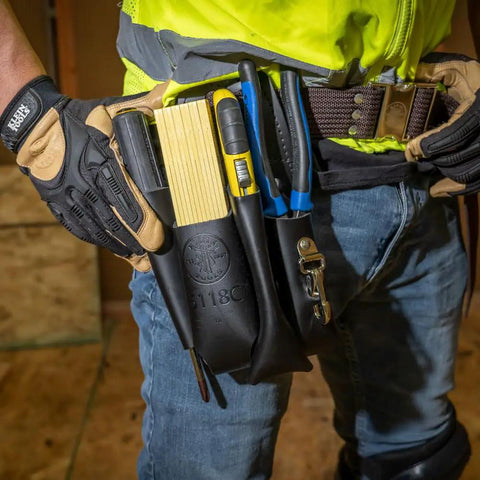 Leather 4 Pocket Tool Pouch With Plier, Ruler And Screwdriver Holders, Worksite Tough Belt Tool Organizer shown on worker's waist