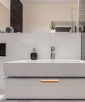White bathroom sink with storage drawer featuring Four Pack Invisible Drawer Pulls 80mm Gold Slick Edge Finger Pulls For Cabinets