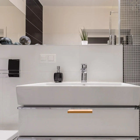 White bathroom sink with storage drawer featuring Four Pack Invisible Drawer Pulls 80mm Gold Slick Edge Finger Pulls For Cabinets