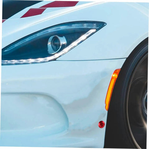 Close-up of car bumper with Toggle Hood Latch Clamp With Quick Release Hood Pin Kit For Race Cars, stainless steel, red pin visible
