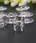 Clear plastic bobbins for 15 Piece Sewing Machine Tool Kit With Bobbins, Screwdrivers, Seam Ripper, Threading Tool And Brush For Home Use And Beginners Easy DIY Sewing Supplies For Quick Repairs And Small Projects.