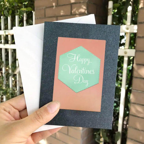 Greeting card with hexagon die cut from Six Piece Cutting Dies Set For Card Making And Scrapbooking, held in hand outdoors