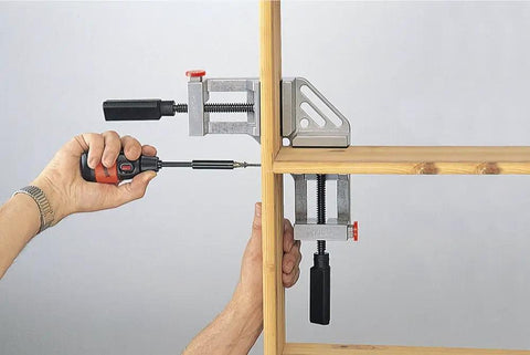 Quick-Jaw Right Angle Corner Clamp for Cabinets and Boxes, 90 Degree Clamp securing a wooden frame for assembly