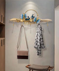 Heavy Duty Wall Mount Coat Hooks For Entryway And Closet, Tough As Nails Metal Rack Holding coats and bags on a wall.