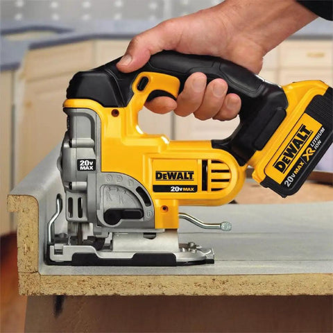 Slick 20V Max Cordless Jigsaw Kit With 4.0 Ah Battery And Fast Charger cutting through laminate at a workbench.