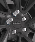 Road Ready Chrome Lug Nuts 60 Degree Conical Seat 12X1.25 Thread on a black wheel, showcasing six spline drive design.