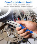 Hand using Rotor Truing Fork Tool For Bike Disc Alignment And Rotor Straightening No Fuss Blue Bicycle Disc Rotor Alignment Tool.