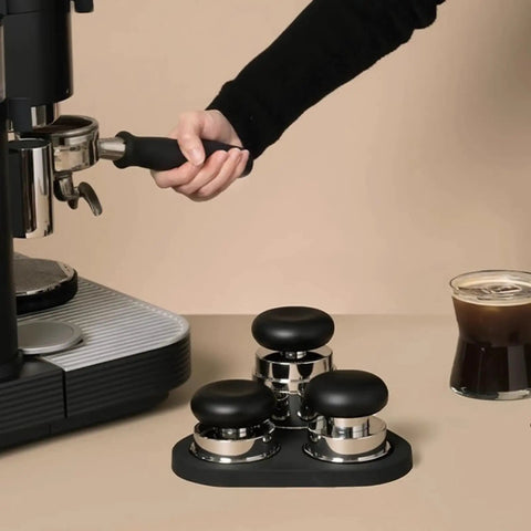 Top Shelf 58mm Espresso Coffee Tamper Set With Spring Loaded Distributors and Powder Tools Plus Magnetic Leveler Pro Barista Gear, featuring a hand-held tamper.