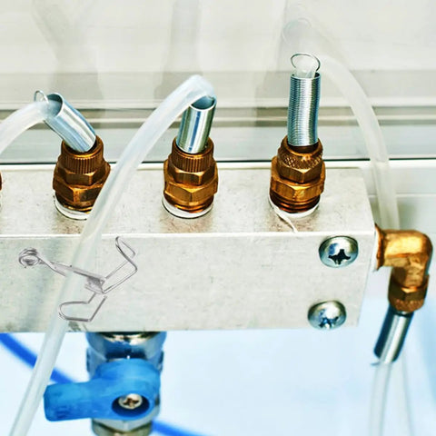 Spring Flow Control Tube Clamps With Bracket Feet For Lab And Classroom Use attached to tubing setup