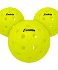 Close-up of Pickleball Performance 40 Outdoor Balls Optic Yellow with 40 precision-drilled holes, USAPA approved for tough outdoor courts.