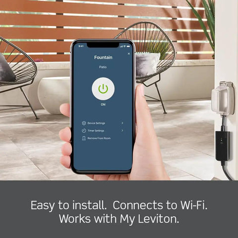 Hand holding smartphone displaying controls for Heavy Duty Smart WiFi Outdoor Plug With Hella Weather Resistant Shell For Holiday Lights Yard Decor And Garden Pumps Matter Enabled Voice Control Switch In Matte Black.