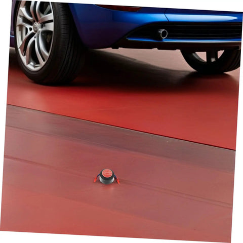 Low Key No Stress Automatic Aerosol Fire Extinguisher 2 Pack With Heavy Duty Back Adhesive Auto Extinguishing Patch For Engine Bay Vehicle Fire Suppression And Garage Safety Gear on red garage floor beneath a car.