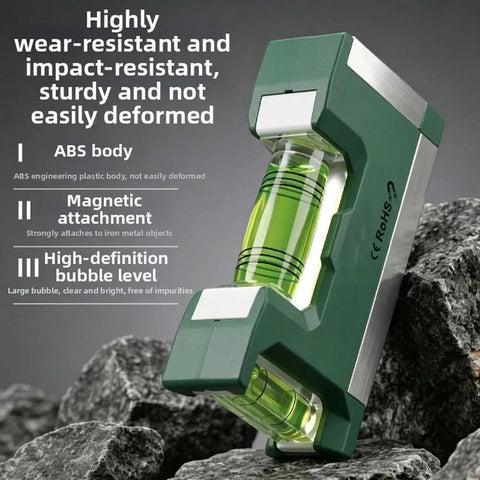 Compact Magnetic Bubble Level 83mm Accuracy for spirit Level for Woodworking Plumbing Metal Surfaces Silver on rocky surface.