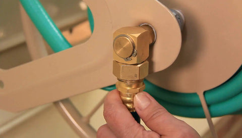Close-up of brass connector on Built Tough Heavy Duty Steel Garden Hose Reel Wall And Floor Mount, 200 Ft Capacity Of 5/8 Inch Hose, Industrial Grade, Rugged Wall Mounted Reel With Non Slip Floor Boots, Weather Resistant Powder Coated Tan Finish