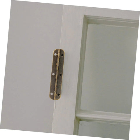 Tank Tough Heavy Duty Piano Hinges For Cabinets And Toolboxes 150 By 10 Mm Antique Brass hinge mounted on a cabinet door.