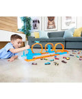 Child playing with Triple Loop Track Set For Kids With 1 To 64 Scale Vehicle Build Crazy Tracks With 3 Loops Speed Snap Tracks