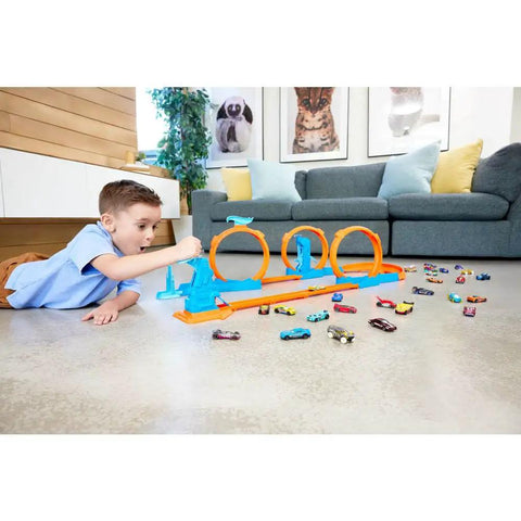 Child playing with Triple Loop Track Set For Kids With 1 To 64 Scale Vehicle Build Crazy Tracks With 3 Loops Speed Snap Tracks