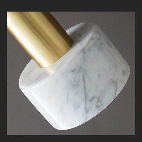 Close-up of HLRCB Indoor Pendant Light, Marble Adjustable Drop, showcasing marble base with brass hardware.