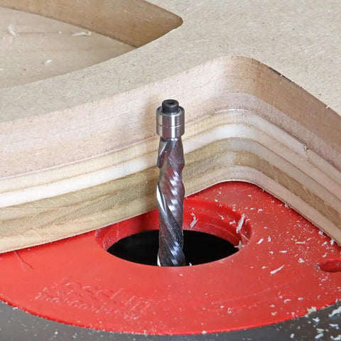Solid Carbide Compression Flush Trim Router Bit Set Runs Smooth As Silk Keeps Clean Cut Lines For Awesome Cabinet Upgrades Two Piece Workshop Kit in use on plywood.