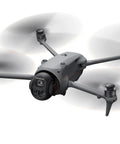 Mavic 4 Pro Drone Bundle With 100MP Hasselblad Wide 6K60 HDR in flight, showcasing its four propellers and sleek design.