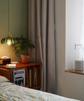 Chic Green Glass Plug In Pendant Light Fixture For Kitchen Island And Dining Room illuminating a bedside table in a cozy setting.