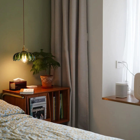 Chic Green Glass Plug In Pendant Light Fixture For Kitchen Island And Dining Room illuminating a bedside table in a cozy setting.