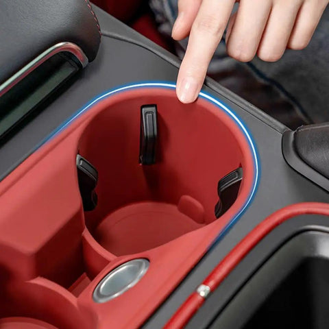 Close-up of Porsche Macan Center Console Organizer Tray 2 Piece Set Silicone Cup Holder Storage Protective Pad 2022-2026 installed