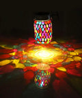Outdoor Mosaic Lanterns Solar Powered Hanging Lights, Rechargeable Mason Jar Style Night Lights With Warm White Glow casting vibrant patterns