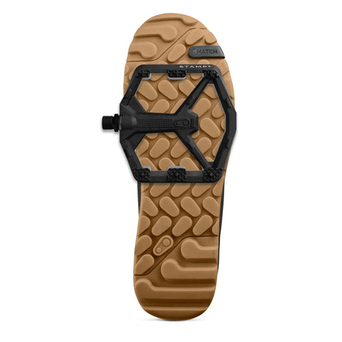 Stamp 0 Flat Pedals For MTB And BMX, Lightweight Composite Body, Large Black, 12 Pins, Top View On Brown Shoe Sole